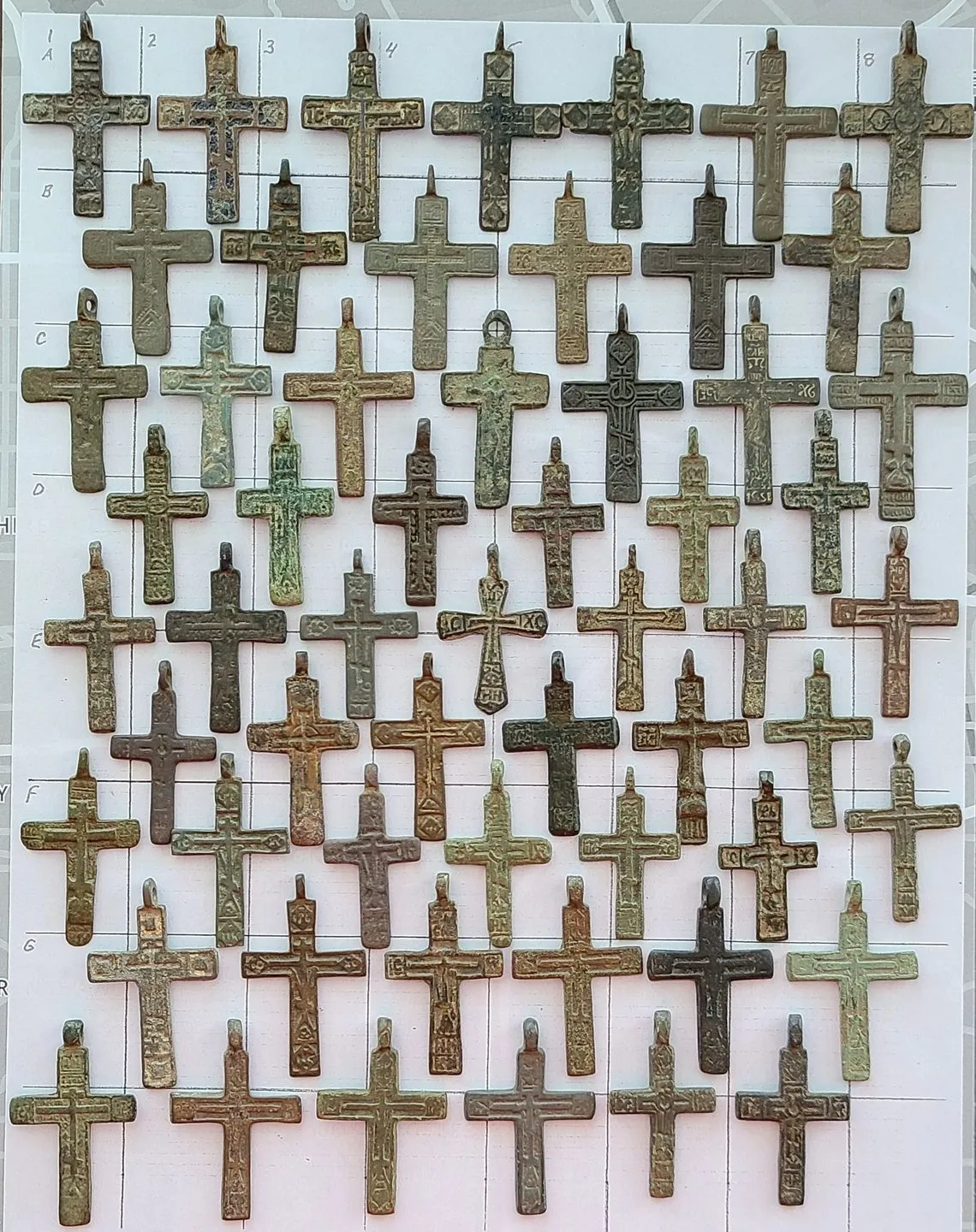 Rows of antique crosses arranged neatly